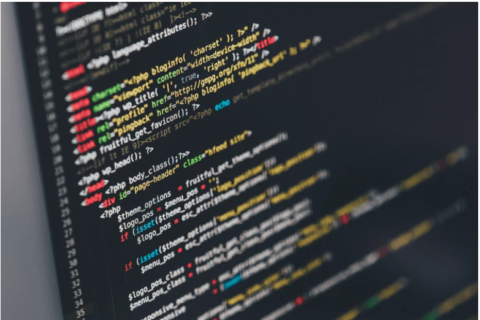 A computer screen with code signifying the importance of security in virtual and hybrid events