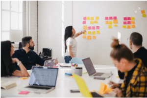 An event planning team prepares for a hybrid meeting